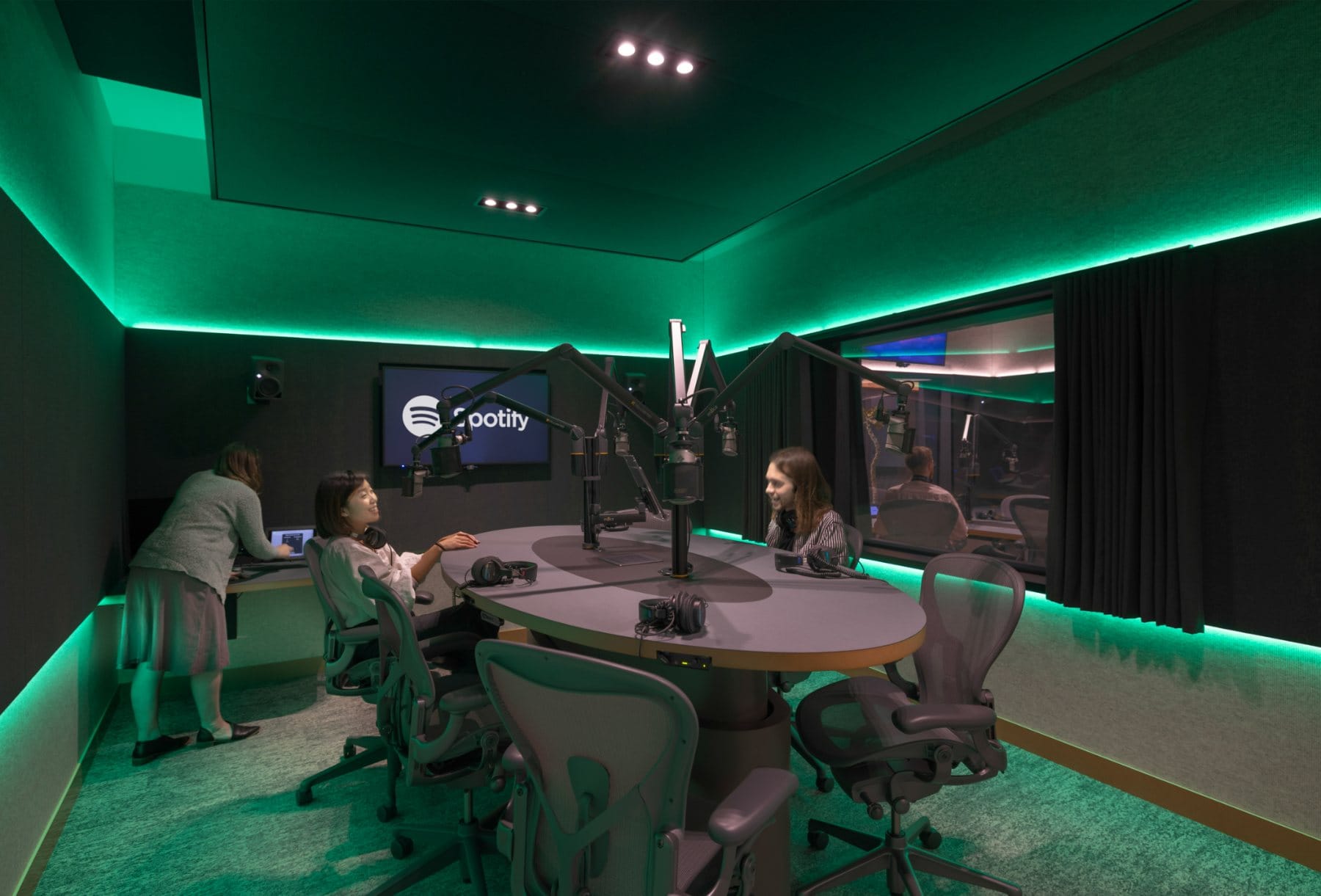 Control room · the mixing console facing the live recording studio