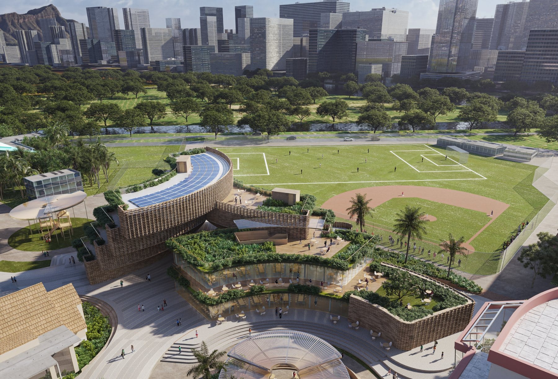 Aerial · the new student center within the 25-acre campus, framed by Diamond Head and the Honolulu skyline