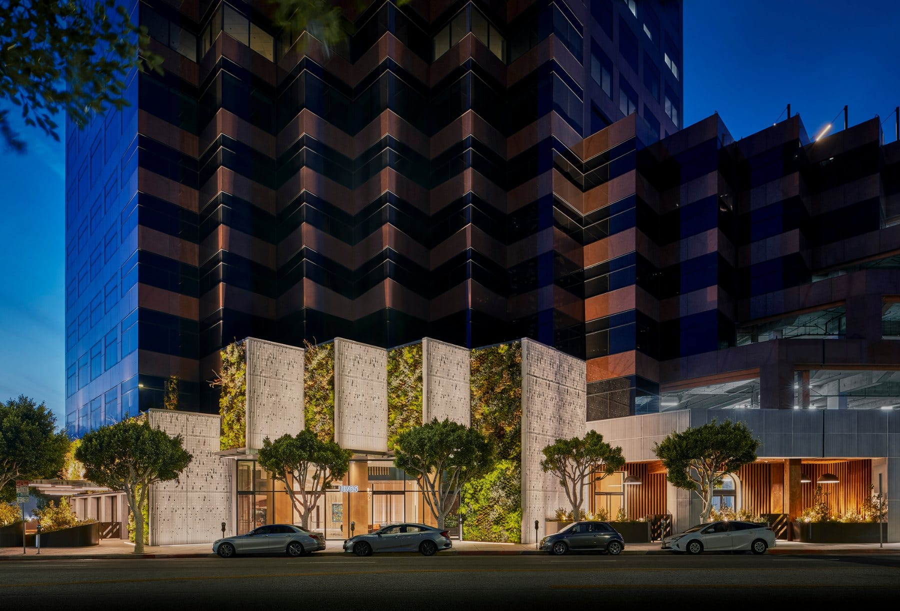 Lobby · arrival under the curved wood-slat ceiling and the new 11755 Wilshire wordmark