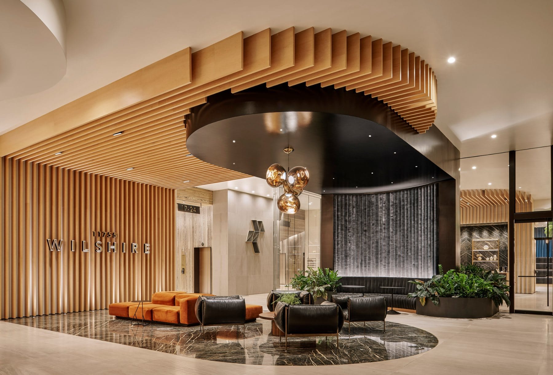 Lounge · seating arrangements organised around the curved black bar and dining counter