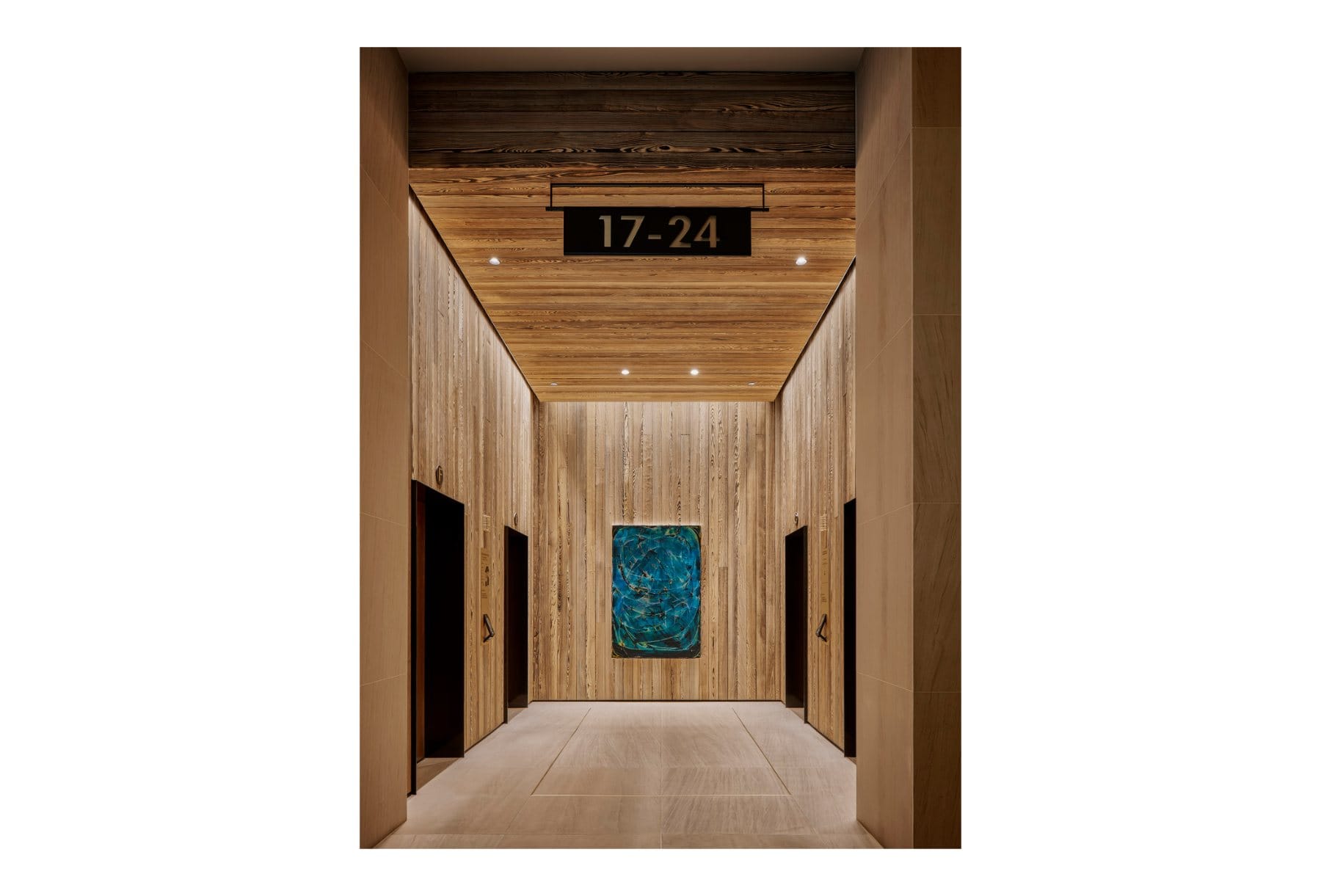 Conference venue · the flexible 100-person hall with tiered seating, curved glass partitions, and access to the outdoor terrace